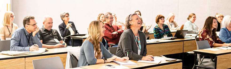 A photo of workshop attendees laughing during the 2022 Annual LDSPMA Conference.