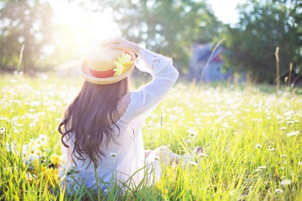 Woman in a field of flowers.