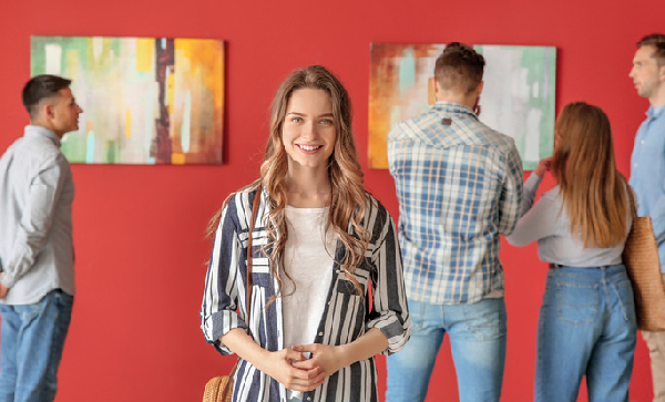 A young woman visits an art gallery.