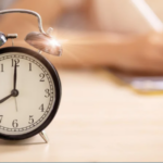 A clock on a desk.