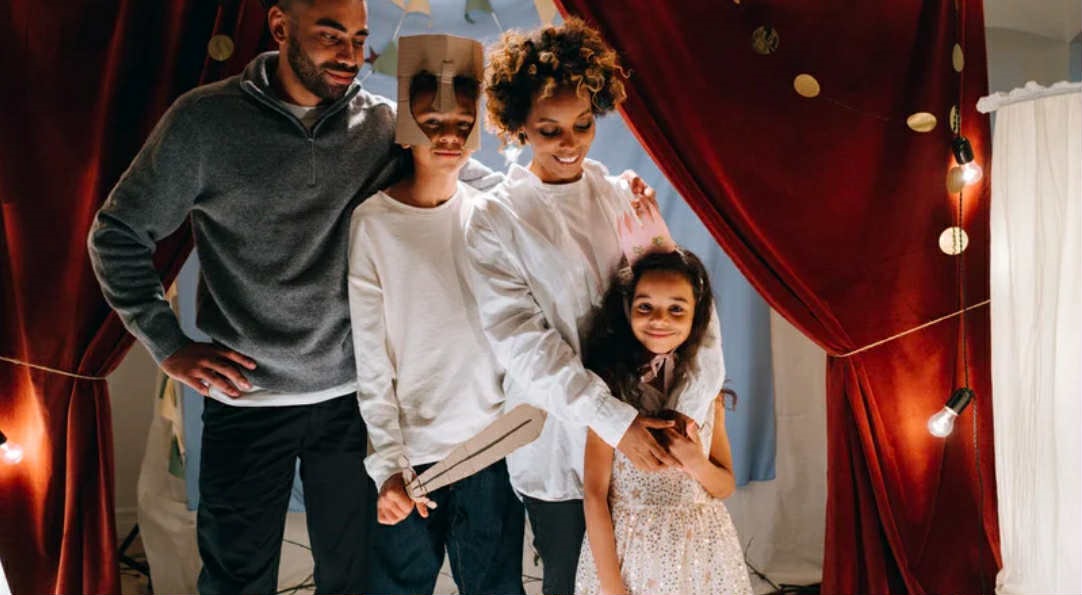 A family participates in a play.