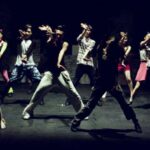 A group of young men dance hip hop.